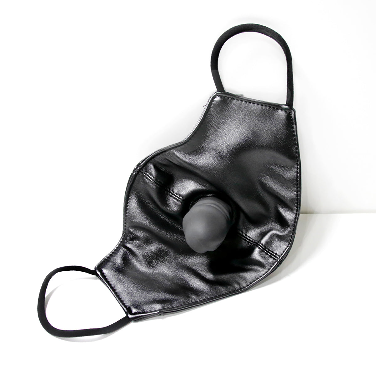 Black vegan leather fashion face mask with a hidden built-in silicone dildo gag for discreet public BDSM play by Sexy Maker.