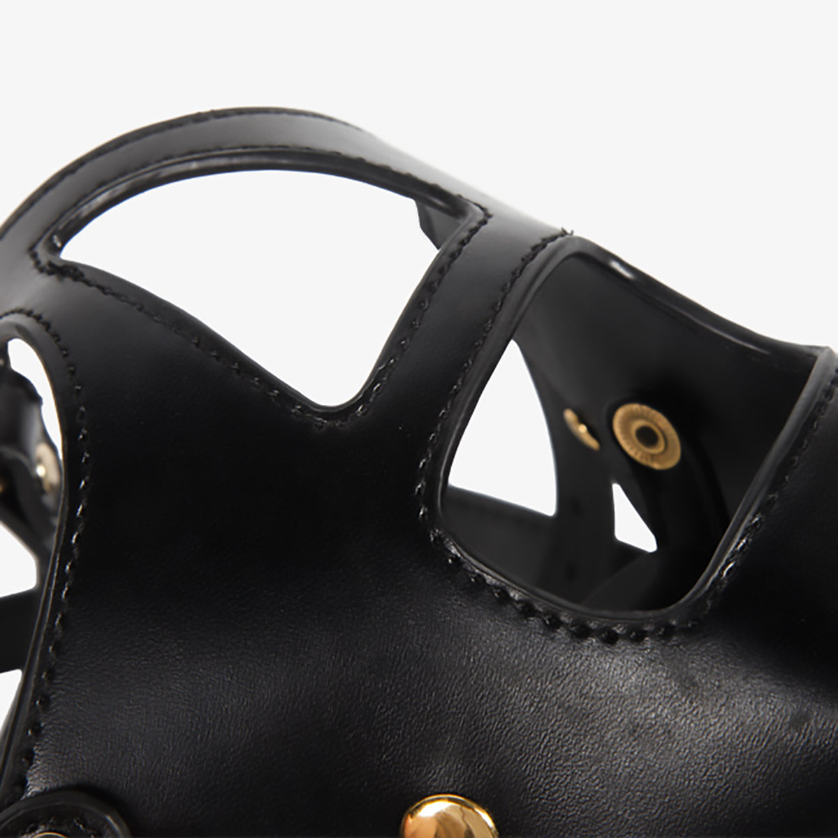 Front view of black vegan leather BDSM bondage muzzle with integrated silicone gag and matching leash by Sexy Maker, adjustable pet play gear.