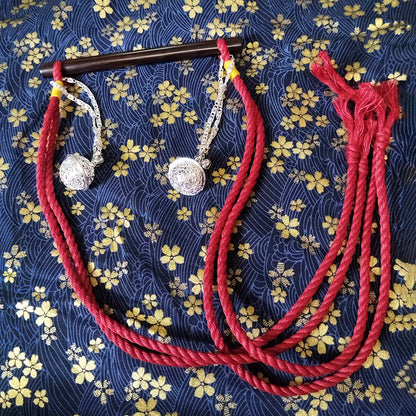 Authentic Japanese BDSM wood gag with crimson red jute rope and sensory bells for Shibari and Kinbaku roleplay by Sexy Maker.