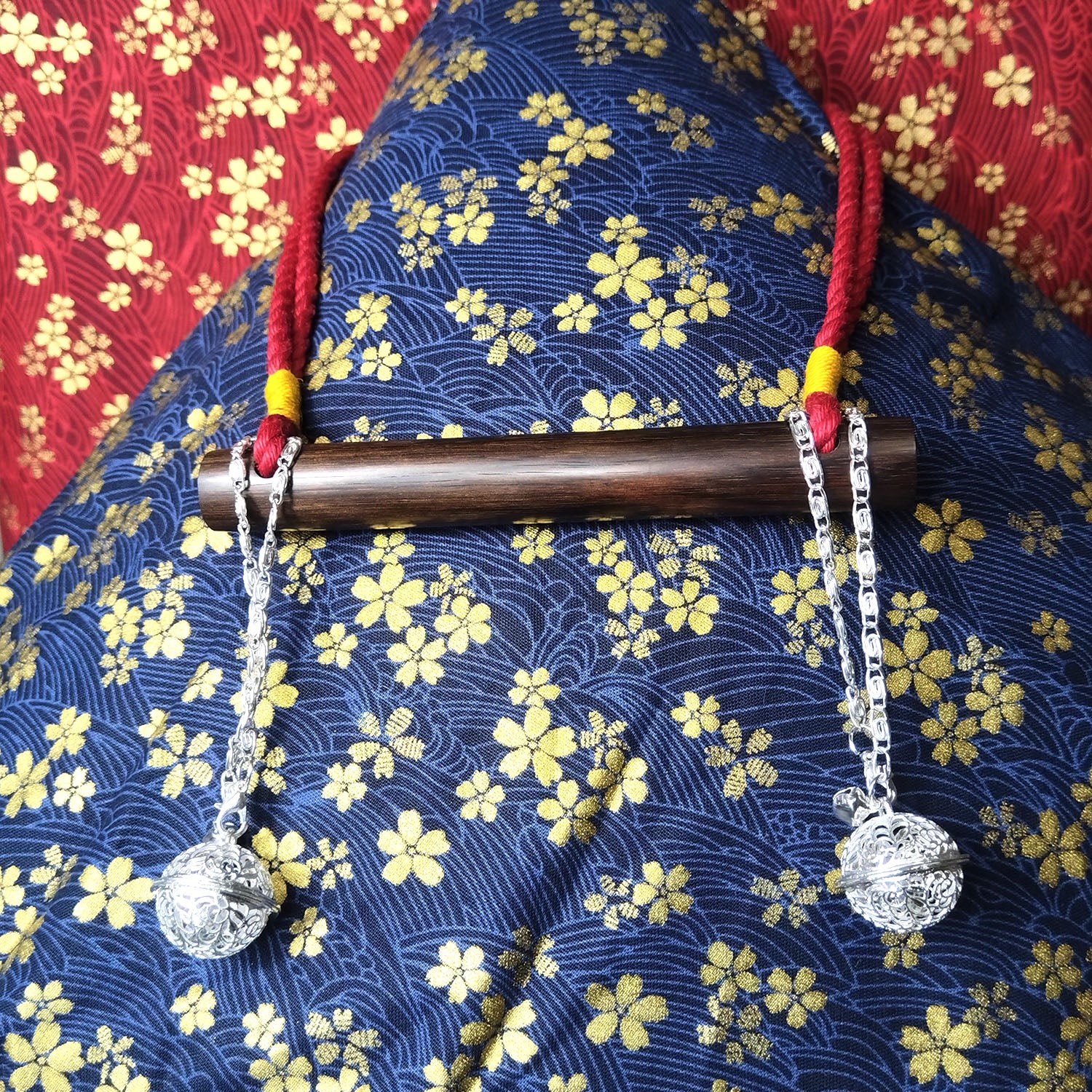 Authentic Japanese BDSM wood gag with crimson red jute rope and sensory bells for Shibari and Kinbaku roleplay by Sexy Maker.