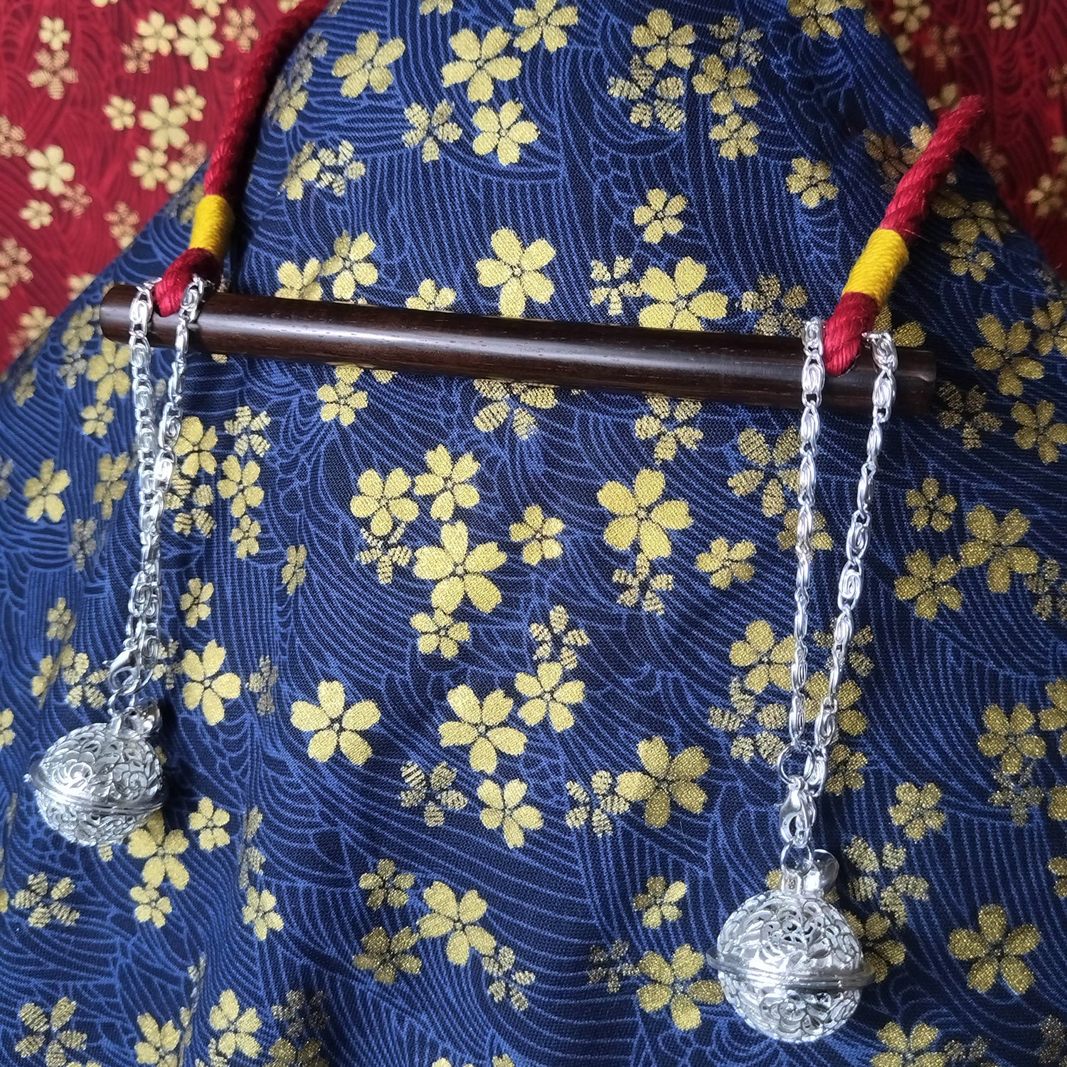 Authentic Japanese BDSM wood gag with crimson red jute rope and sensory bells for Shibari and Kinbaku roleplay by Sexy Maker.
