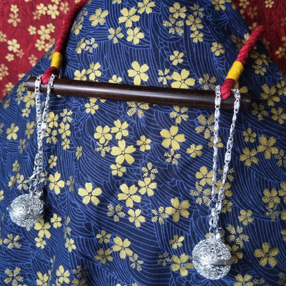 Authentic Japanese BDSM wood gag with crimson red jute rope and sensory bells for Shibari and Kinbaku roleplay by Sexy Maker.