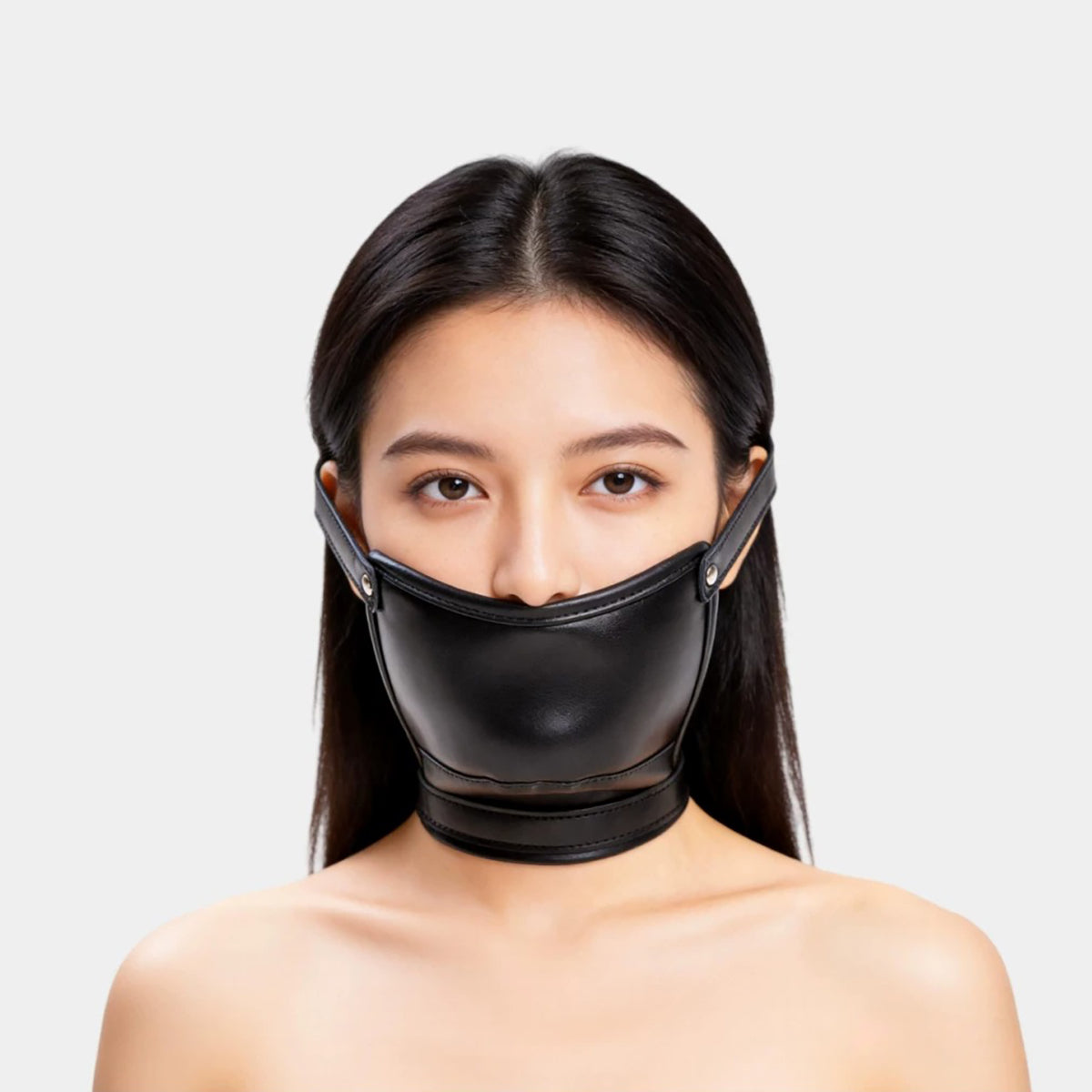 Front view of black vegan leather concealed dildo gag mask with adjustable head and neck straps for oral restraint by Sexy Maker.