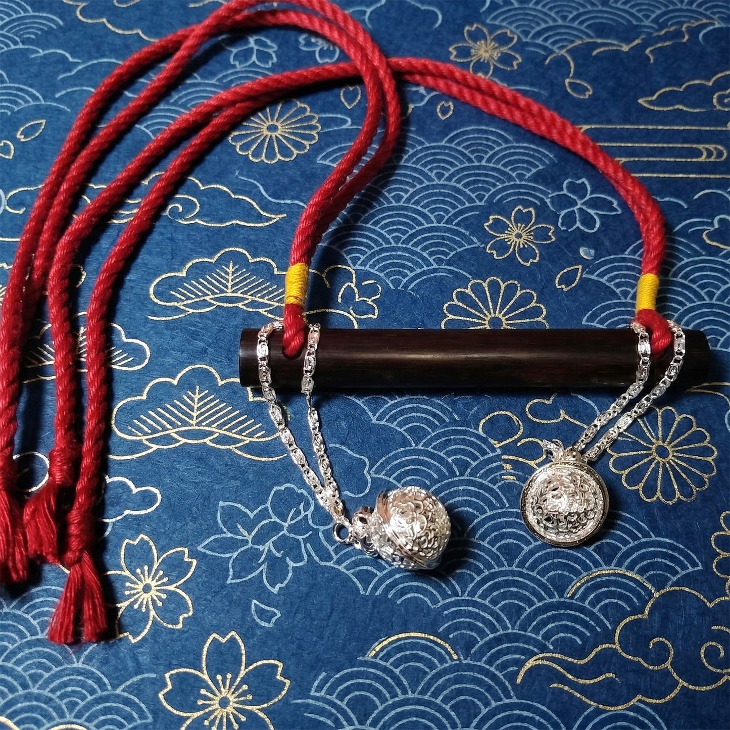 Authentic Japanese BDSM wood gag with crimson red jute rope and sensory bells for Shibari and Kinbaku roleplay by Sexy Maker.