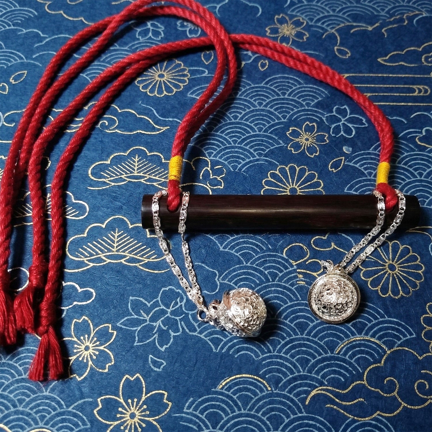 Authentic Japanese BDSM wood gag with crimson red jute rope and sensory bells for Shibari and Kinbaku roleplay by Sexy Maker.