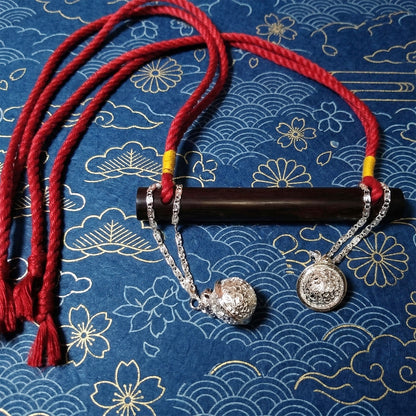Authentic Japanese BDSM wood gag with crimson red jute rope and sensory bells for Shibari and Kinbaku roleplay by Sexy Maker.