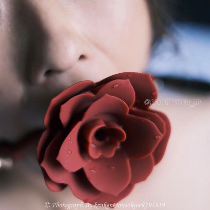 Close-up of breathable red silicone rose ball gag with adjustable vegan leather straps for aesthetic BDSM play by Sexy Maker.