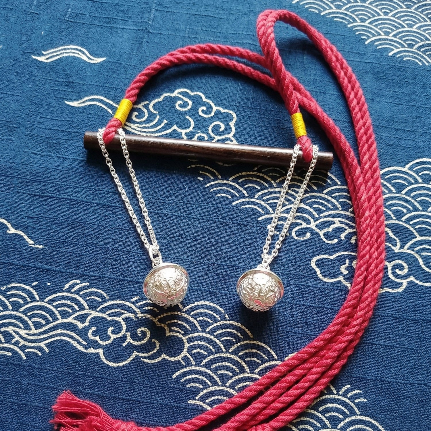 Authentic Japanese BDSM wood gag with crimson red jute rope and sensory bells for Shibari and Kinbaku roleplay by Sexy Maker.