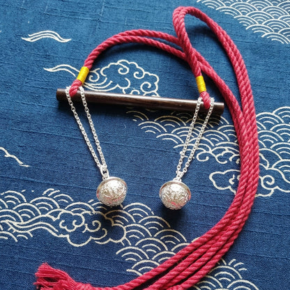 Authentic Japanese BDSM wood gag with crimson red jute rope and sensory bells for Shibari and Kinbaku roleplay by Sexy Maker.