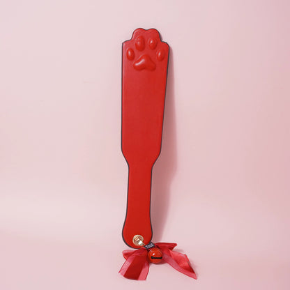 Close-up of the complete 7-piece premium vegan leather bondage starter set featuring padded cuffs, collar, and paw print paddle by Sexy Maker.