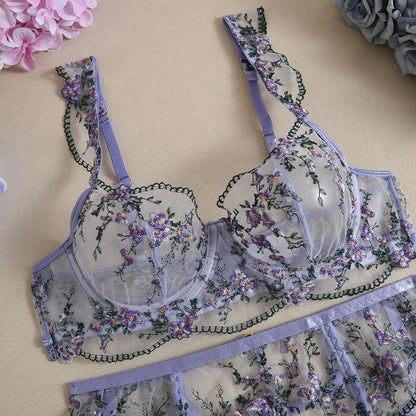 Front view of women's 3-piece lavender floral embroidery lace lingerie set featuring sheer mesh push-up bra and garter belt by Sexy Maker.