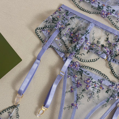 Front view of women's 3-piece lavender floral embroidery lace lingerie set featuring sheer mesh push-up bra and garter belt by Sexy Maker.