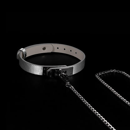 Close-up of premium cracked ice genuine leather BDSM collar featuring a minimalist metal lock plate and matching leash by Sexy Maker.