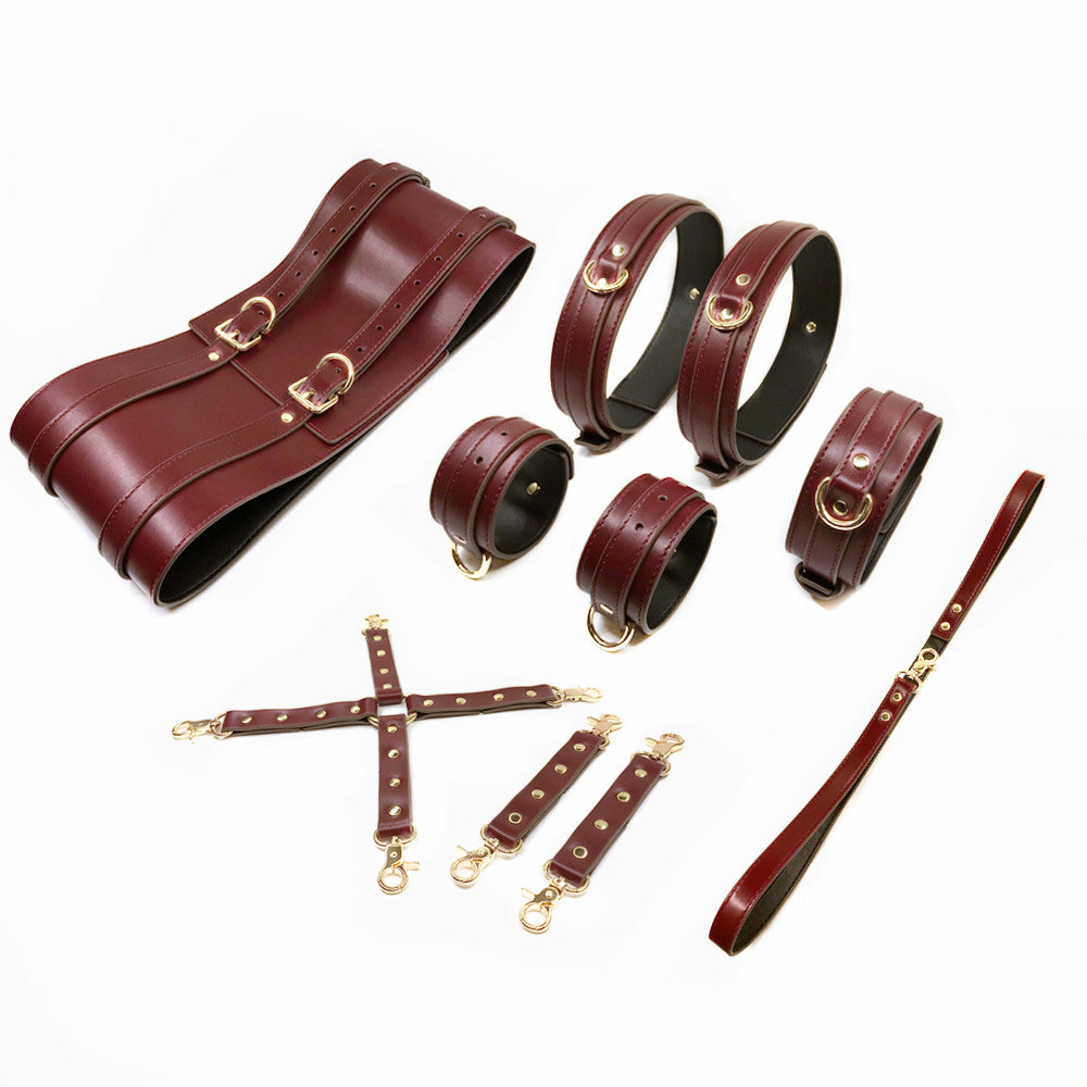 Elegant 6-piece glossy burgundy vegan leather full-body bondage set with gold hardware, corset, and hogtie restraints by Sexy Maker.